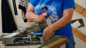 Woman disassembling computer