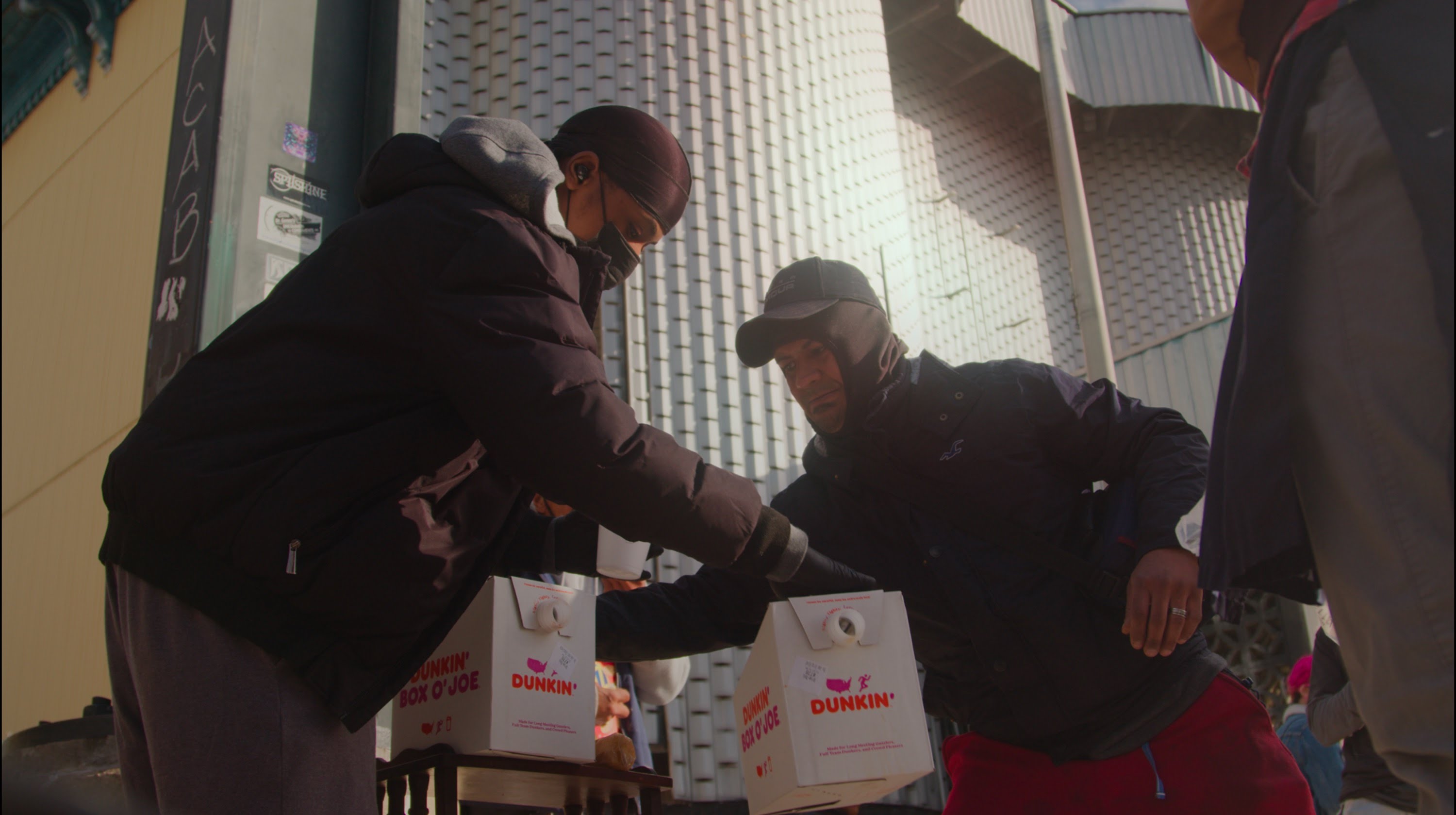 Livingston delivering coffee to community members.