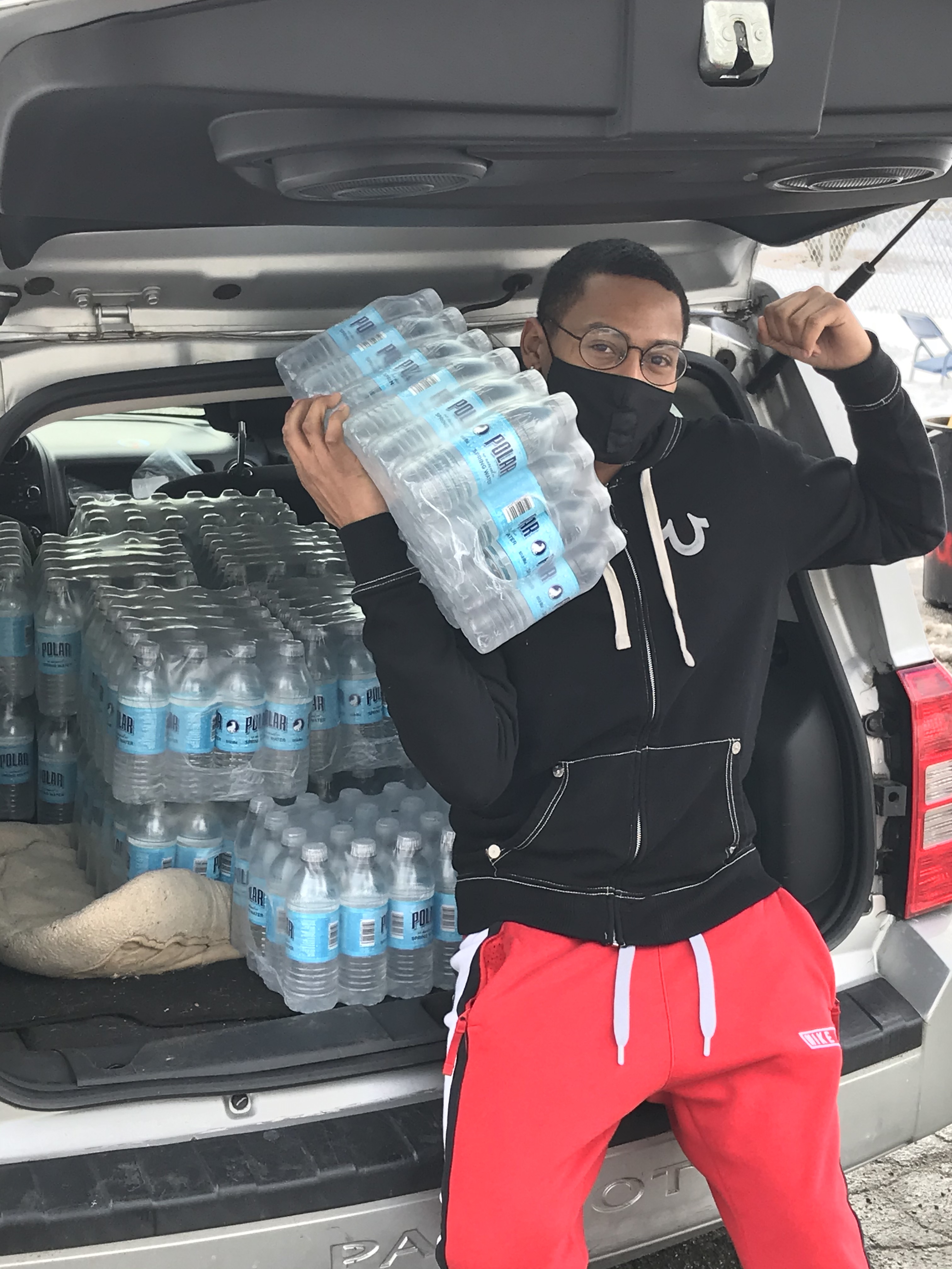 Mekhi distributing bottled water.