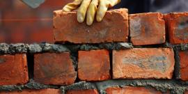 A brick wall being built.