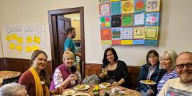 Equal Care Co-op members sitting around a table.