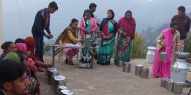 Dairy Co-op members collecting milk.