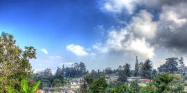 Panoramic view of a Haitian town on a lush hillside.