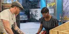 Devon Curtin helps teach a little free library workshop at PVD Things in 2024
