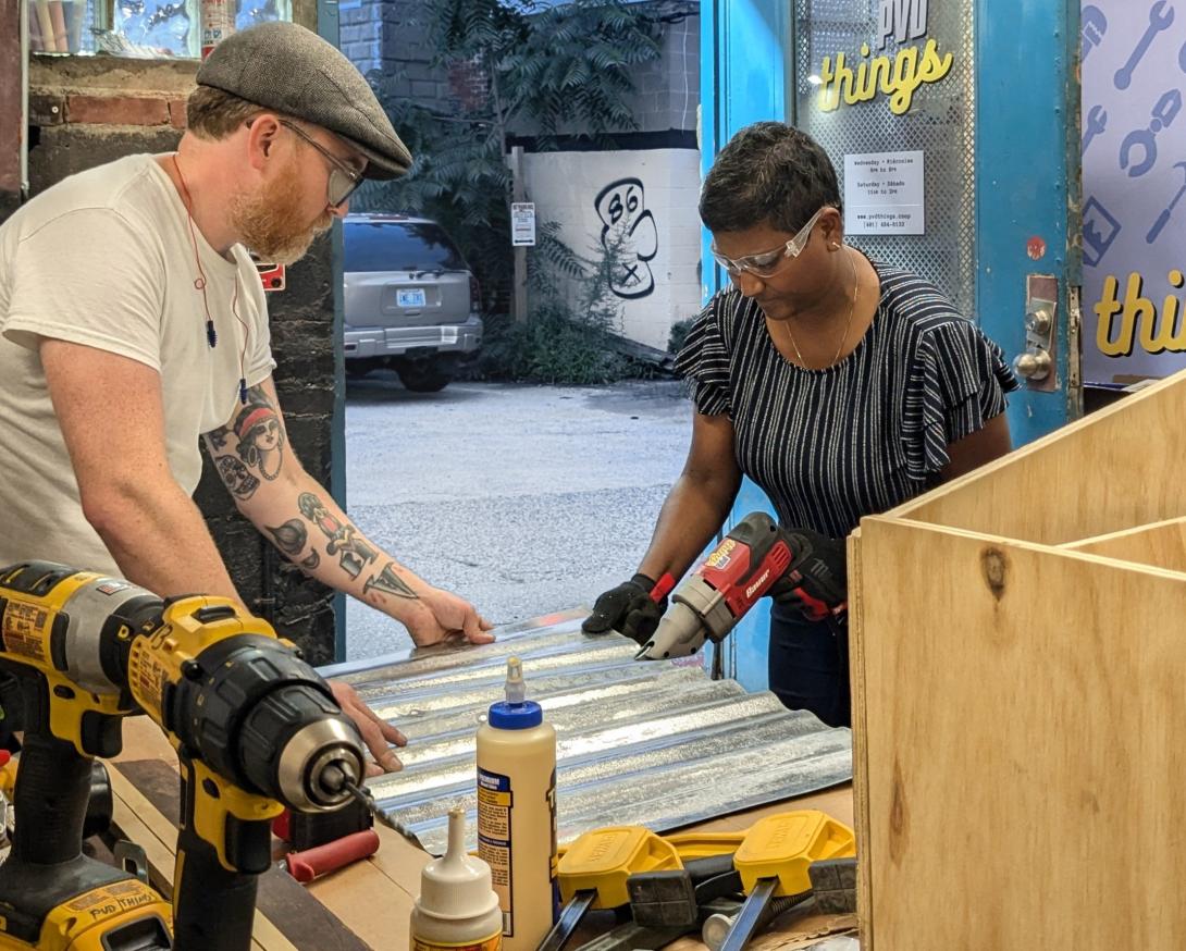 Devon Curtin helps teach a little free library workshop at PVD Things in 2024