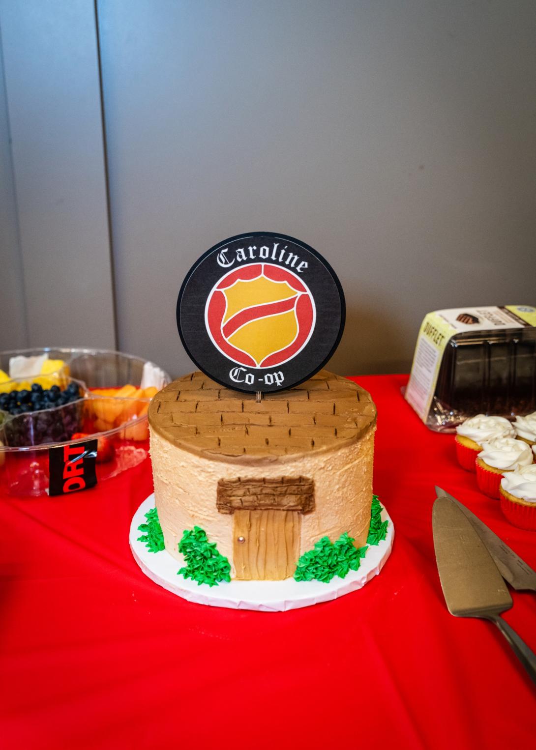 A cake celbratating the founding of the Caroline Co-op.