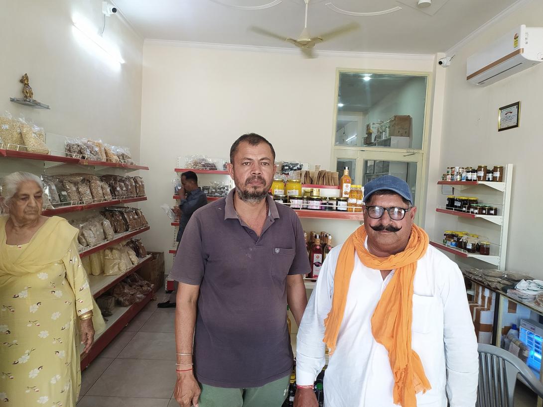 Rakesh Godara, former director of the Farmer Producer Organisation, and member Bhagwan Singh Khudi at the FPO’s store in Hanumangarh.