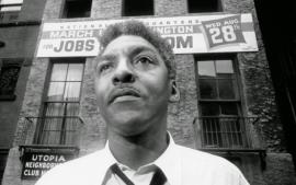 Bayard Rustin outside the headquarters of the March on Washington.