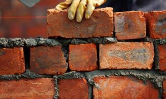 A brick wall being built.