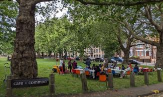 Care Commons group meets in a park.