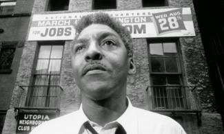 Bayard Rustin outside the headquarters of the March on Washington.