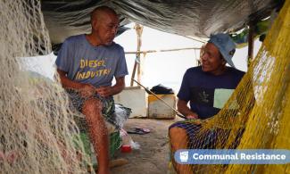 Ayacucho fisherman mending nets.