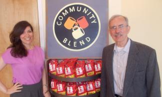 Esther and Ray West standing at the fair trade coffee shop in Cincinnati with Equal Exchange co-op coffee.