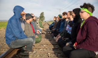 Meditation on rail track blockade at Break Free Pacific Northwest, USA, 2016. | Flickr/Alex Garland. CC BY 2.0.
